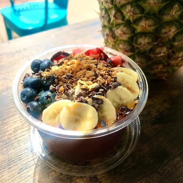 Gansett Poke acai bowl with blueberries, bananas, strawberries, granola, and cacao nibs.