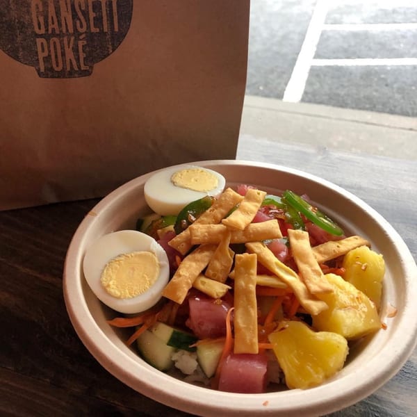 Gansett Poke bowl with tuna, pineapple, cucumber, egg, and crispy wonton strips.